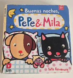 El libro Buenas noches, Pepe y Mila, de SM, con el perro y el gato en la cama, gastado por el uso